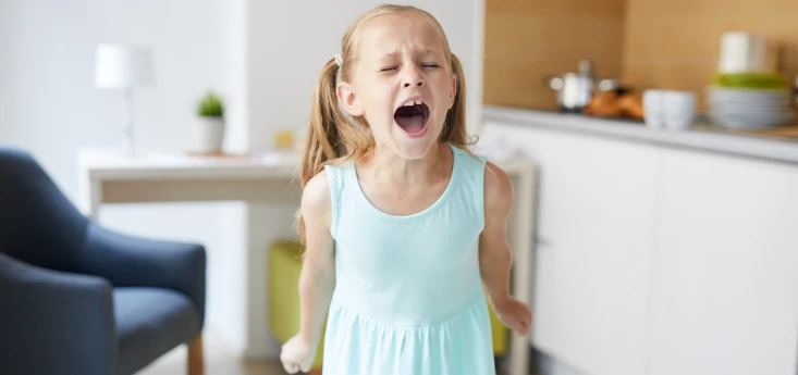 How Poor Sleep and Breathing Affect Focus and Mood - Atkins & Anderson DDS image of a tired, upset child at home showing behavioral changes.